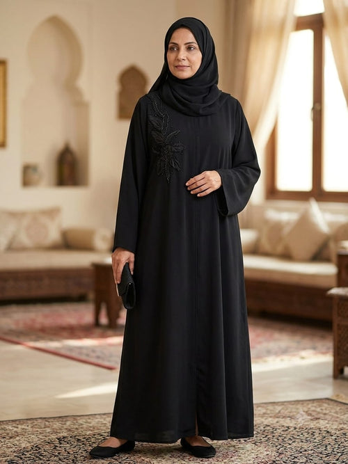 Abaya Nashel Flower Black - black abaya with beaded floral spray on the shoulder